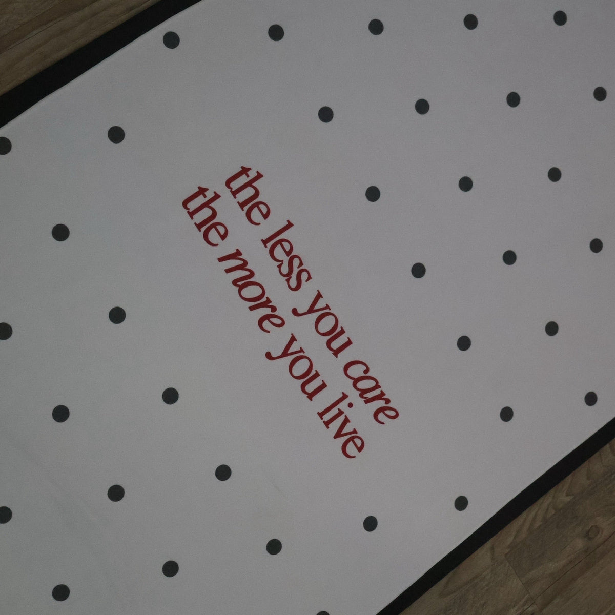 Muse yoga and Pilates towel with black polka dots and red quote detail